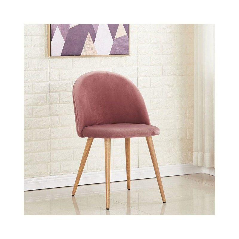 Scandinavian oak dining table set with velvet chairs featuring a pink velvet chair, perfect for modern dining decor.