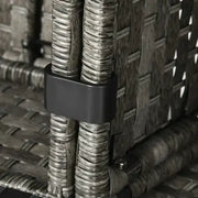 Close-up of a woven outdoor chair with a dark gray/black plastic band securing two vertical wicker strands together.