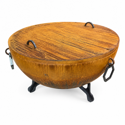A round wooden fire pit table with a warm honey-brown wood grain finish, supported by three black metal legs and featuring black metal handles on both sides, shown against a plain white background.