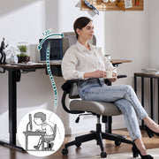 Woman sitting at a desk with ergonomic chair support illustration